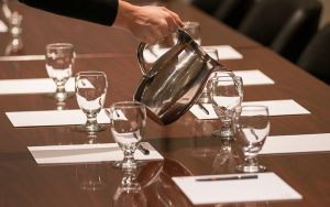 meeting table with water pitcher